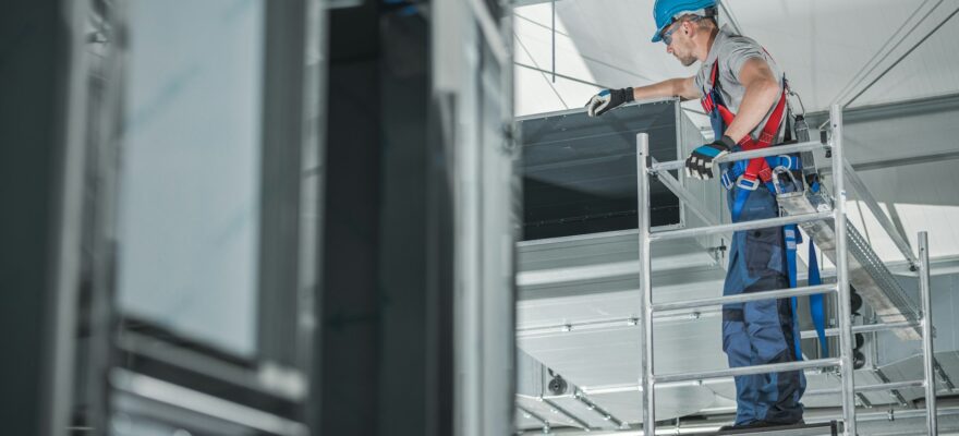 construction-worker-checking-newly-installed-air-ventilation