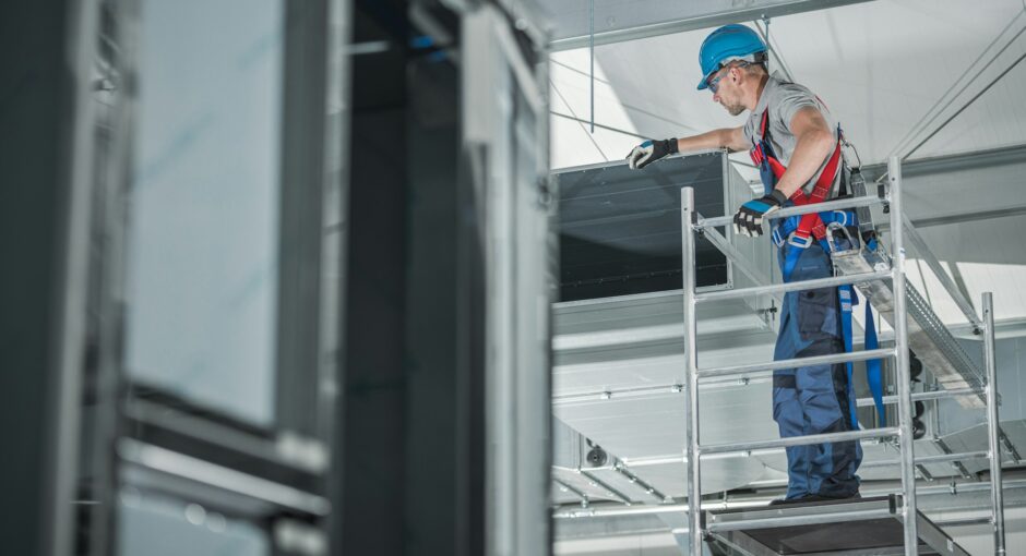 construction-worker-checking-newly-installed-air-ventilation