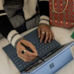 girl with laptop choosing gifts