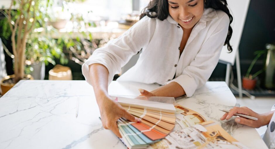 woman-holding-a-palette-with-color-samples-and-smiling